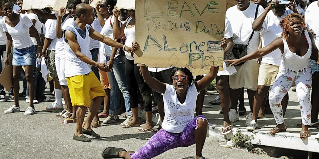 A Jamaican demonstrator in support of Christopher "Dudus" Coke at a march in Kingston.