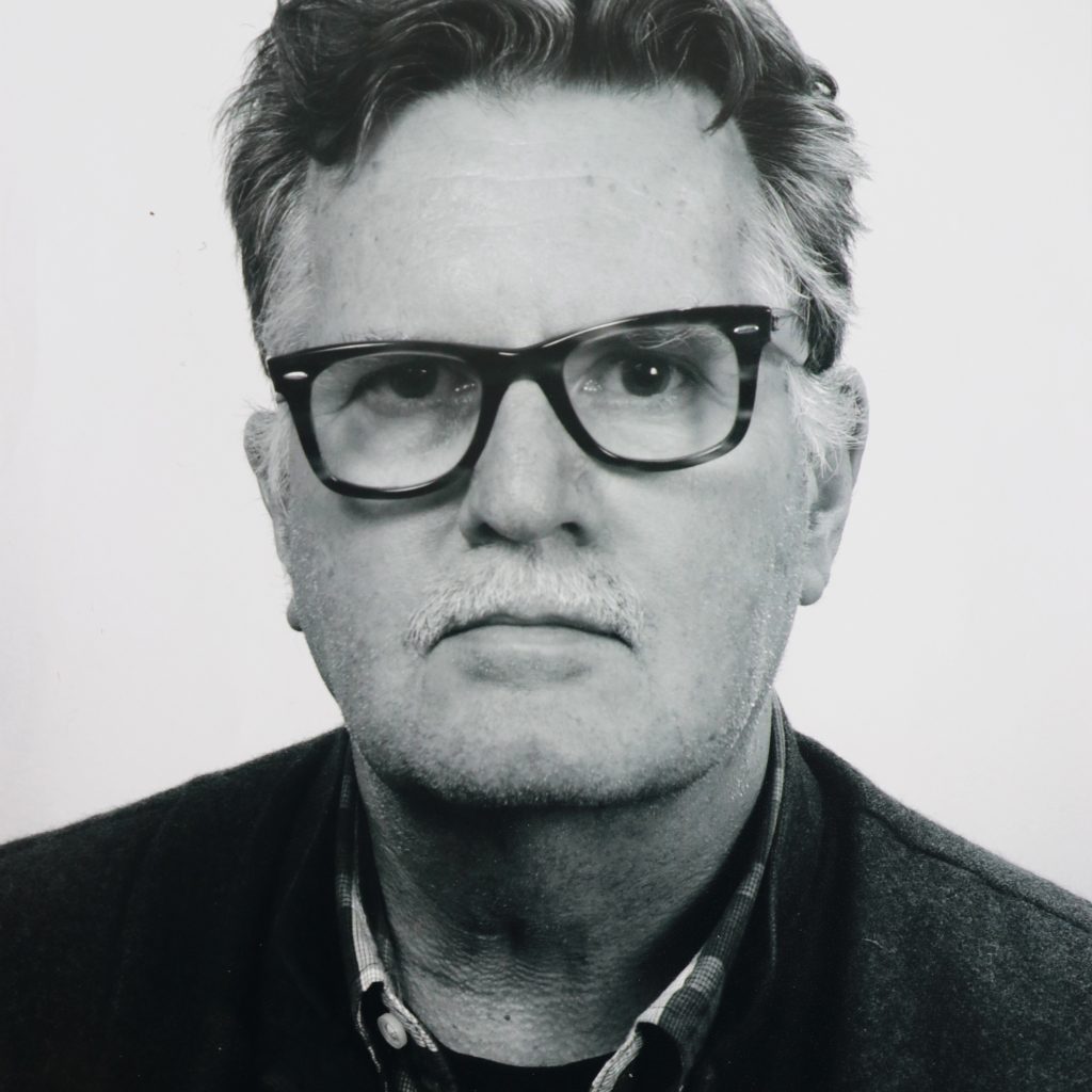 Black-and-white headshot of Christopher Pinney.