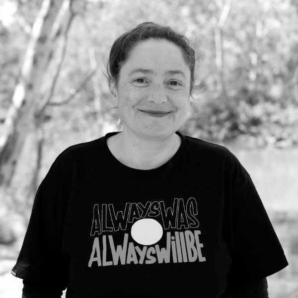 A photograph of a woman smiling at the camera.