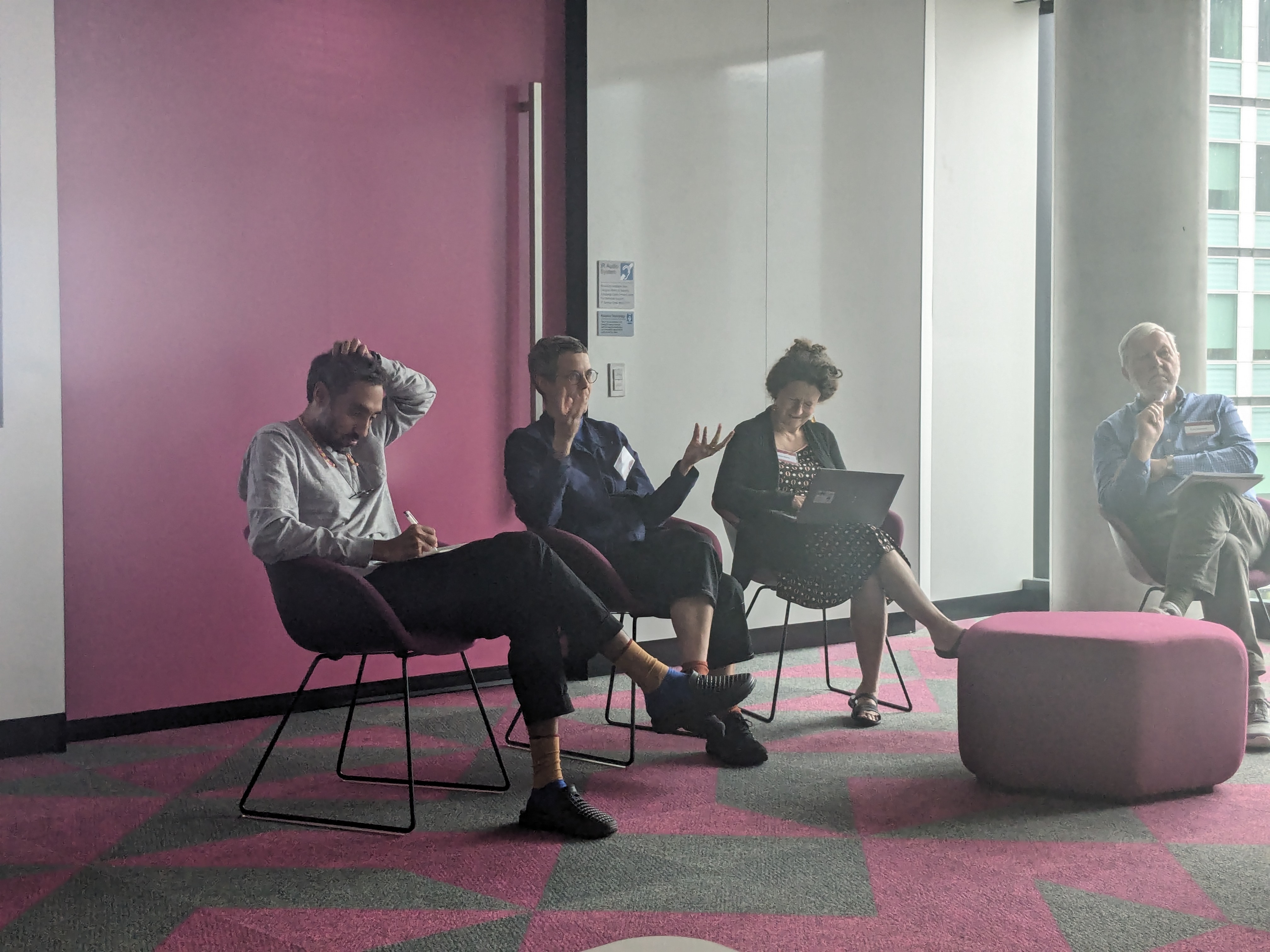 A group of four panel speakers.