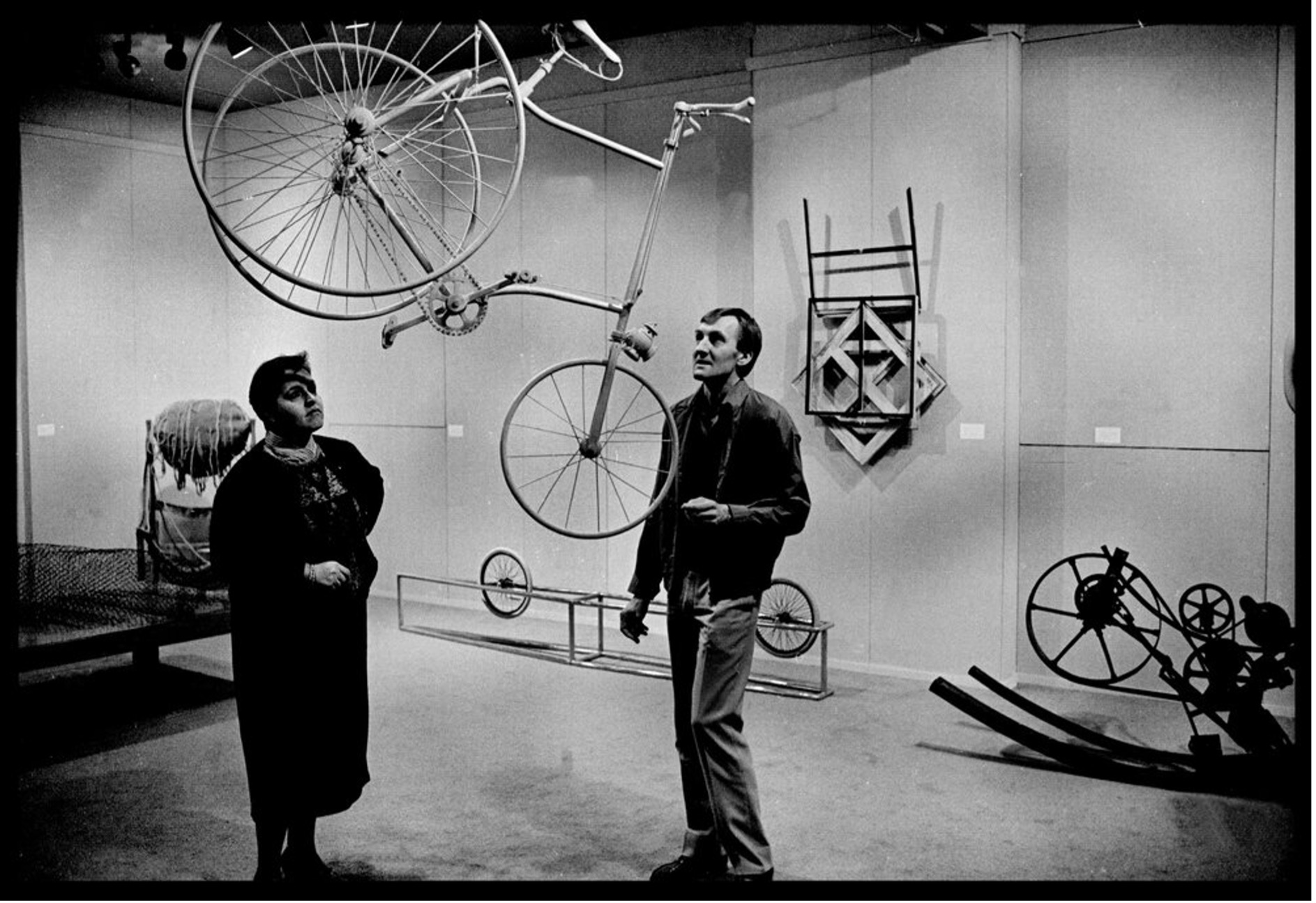 A photograph of Leon Paroissien and Joyce Parszos standing in the Power Gallery of Contemporary Art.