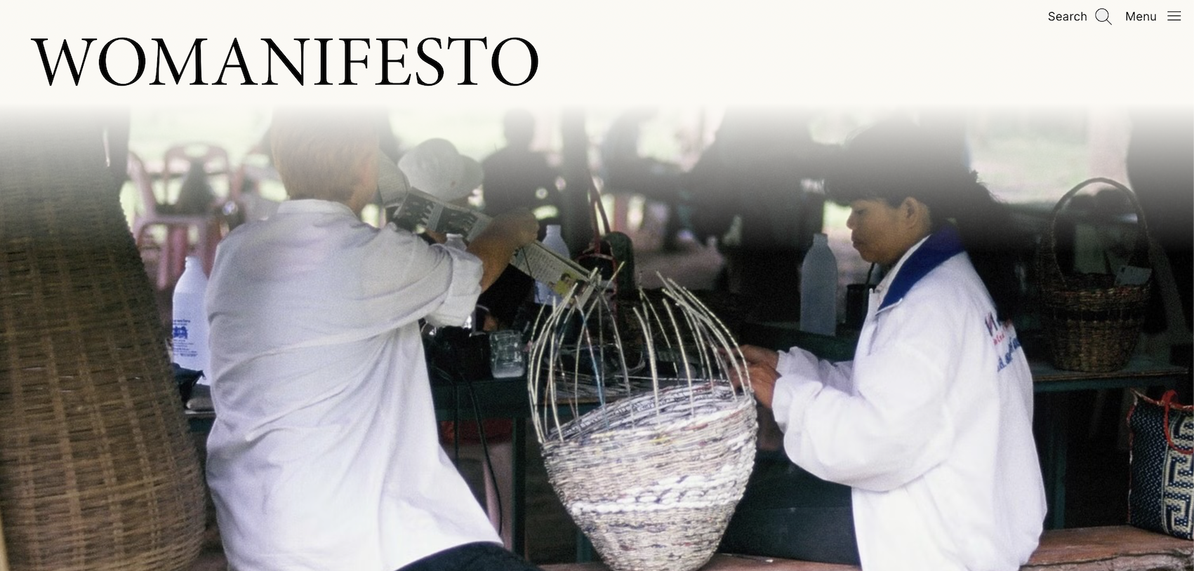 Screenshot of the homepage of Womanifesto with photo two women weaving