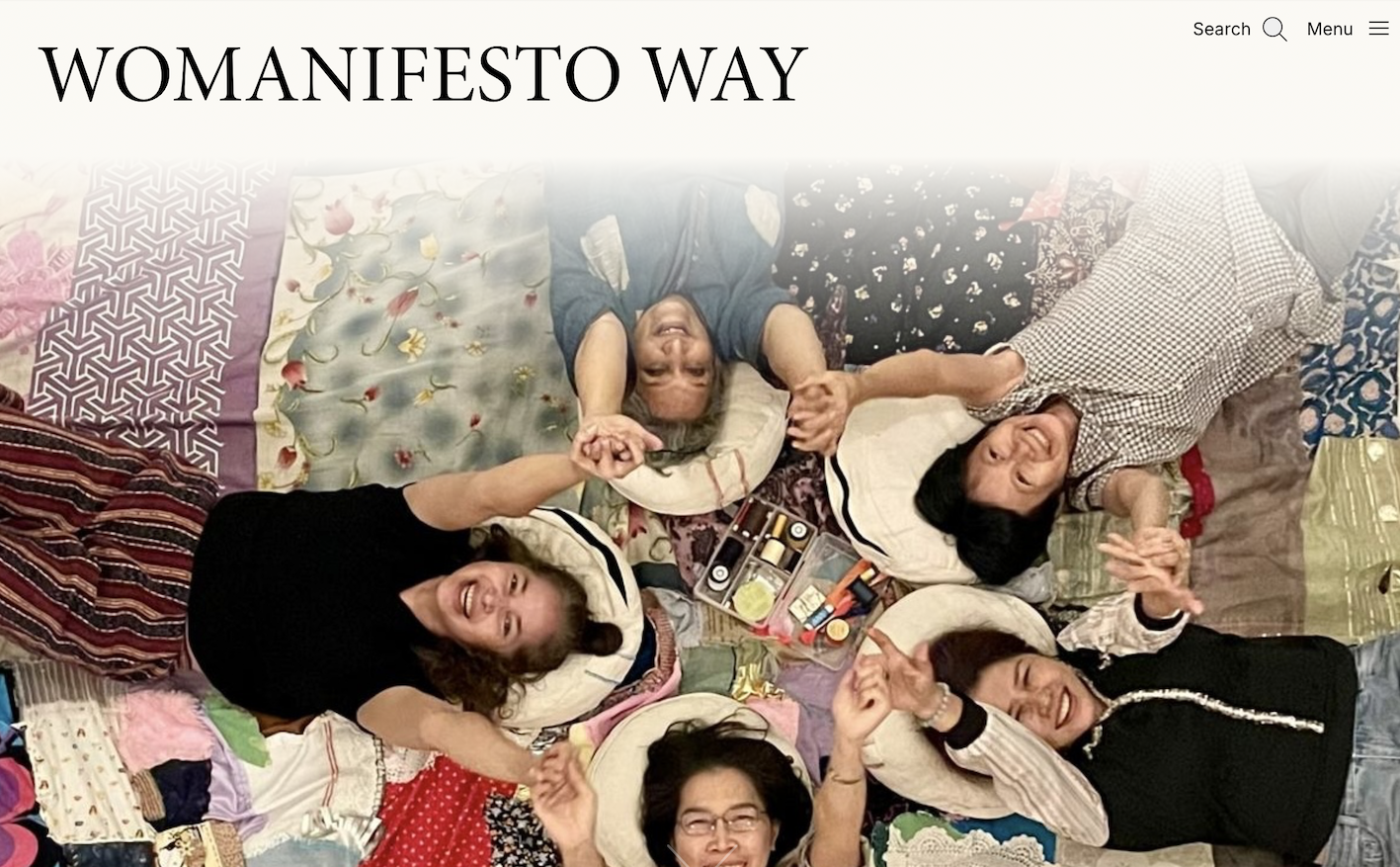 Screenshot of the Womanifesto homepage with image from WeMend