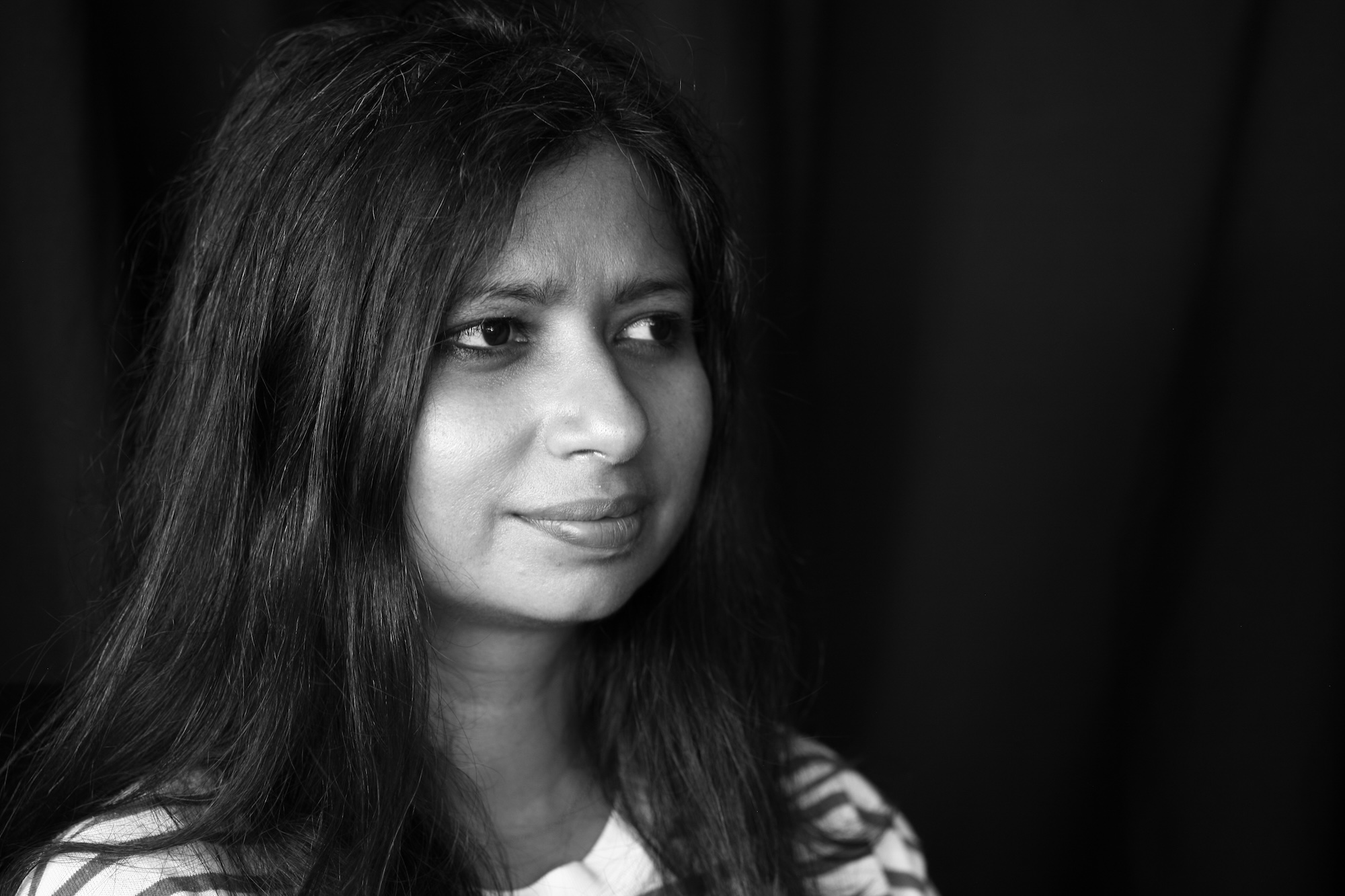 A black and white photograph of Neha Kale