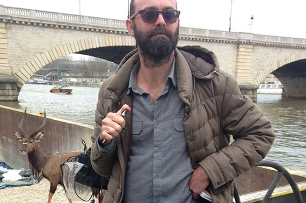 Ben Ferris on the Seine in front of his work in progress.